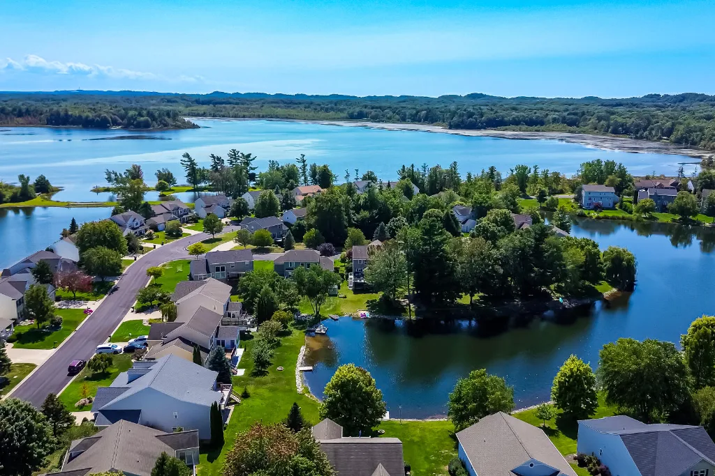 Aerial view of a Wyoming, MI neighborhood with homes around a small lake